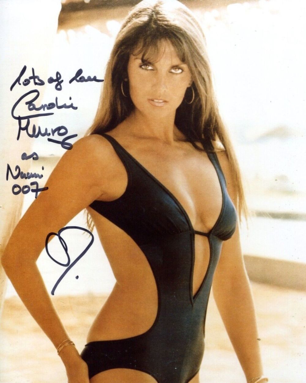 Lot 217: 007 Bond girl Caroline Munro signed black swimsuit...