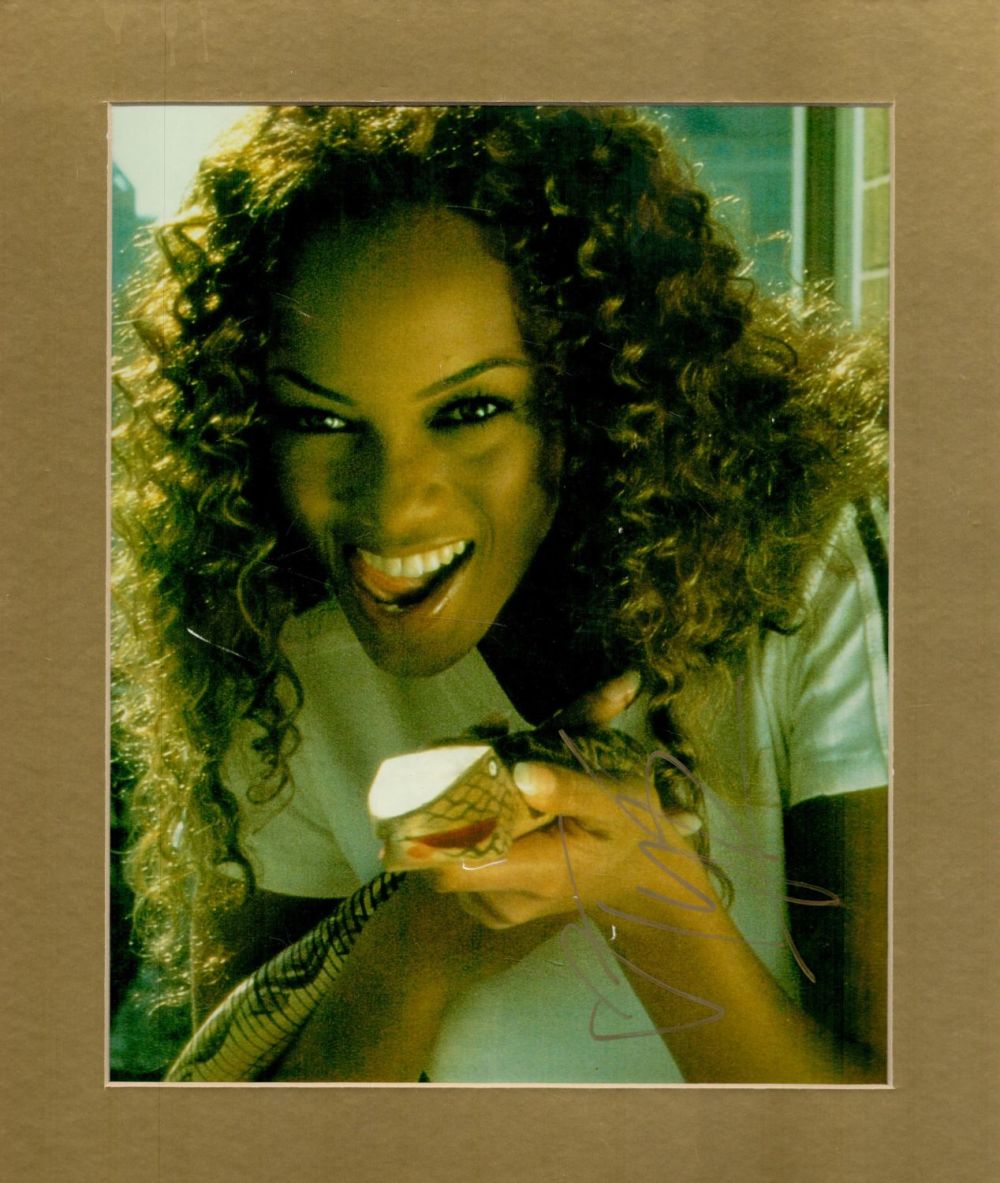 Lot 233: Tyra Banks signed 12x10 overall mounted colour photo....
