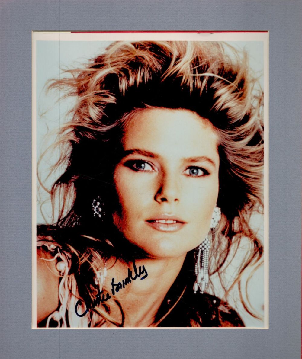 Lot 235: Christie Brinkley signed 12x10 overall mounted colour photo....