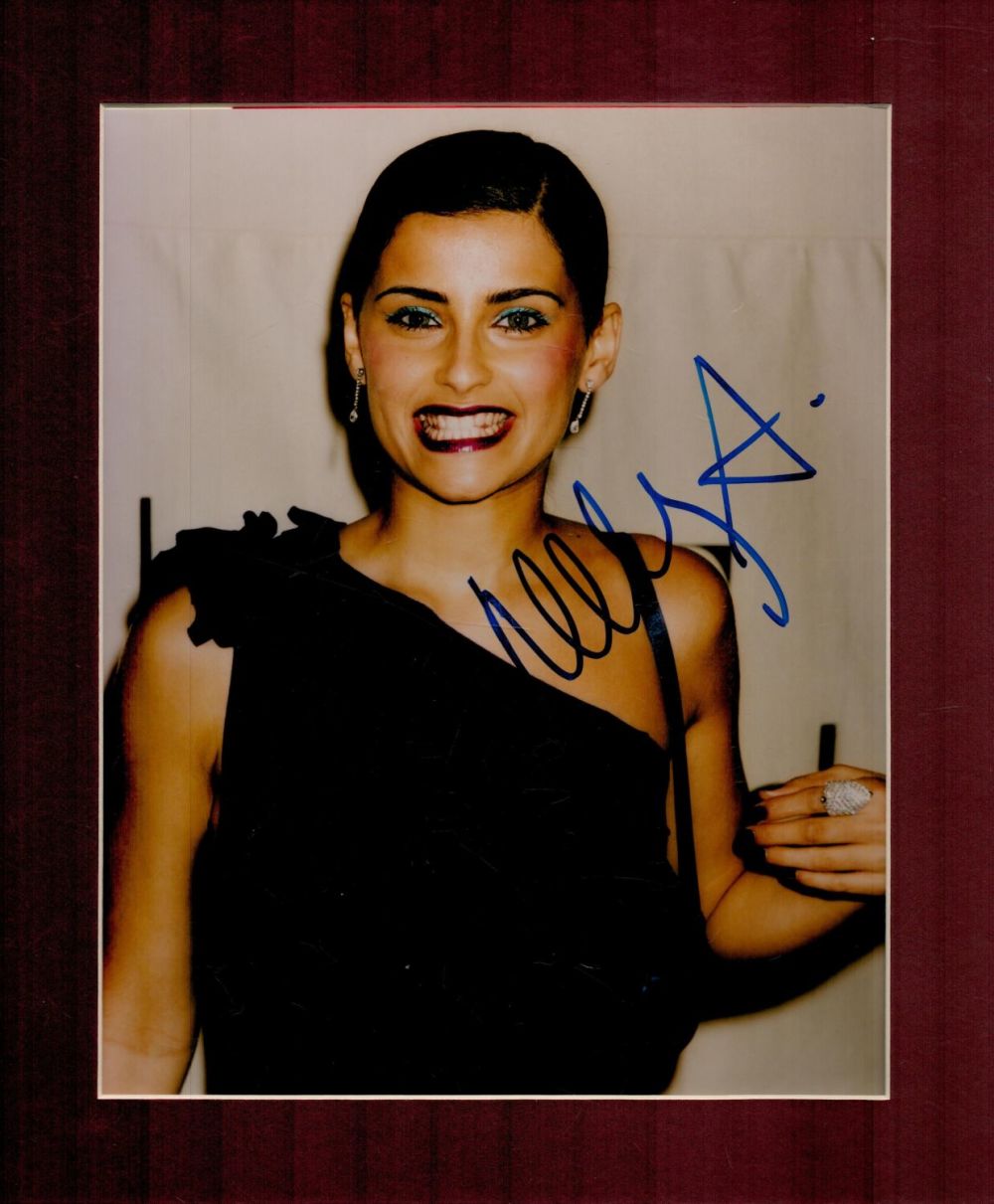 Lot 244: Nelly Furtado signed 12x10 overall mounted colour photo....