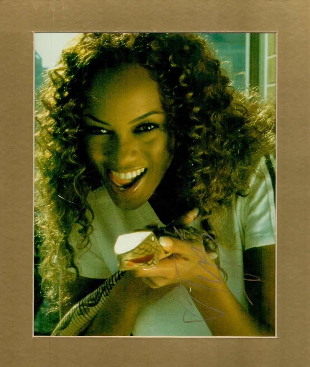 Lot 432: Tyra Banks signed 12x10 overall mounted colour photo....
