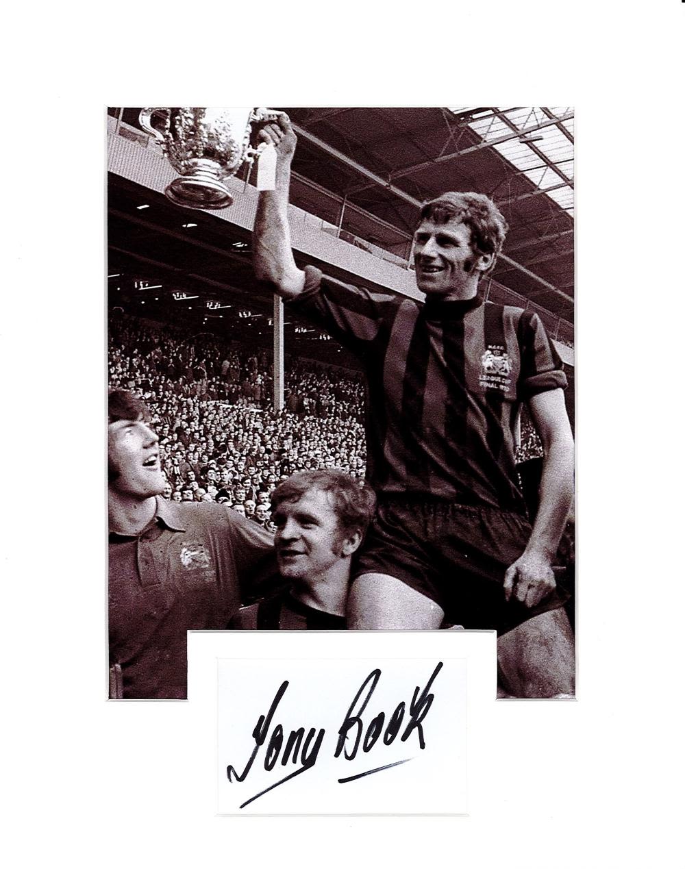 Lot 508: Tony Book signature piece mounted below black and...