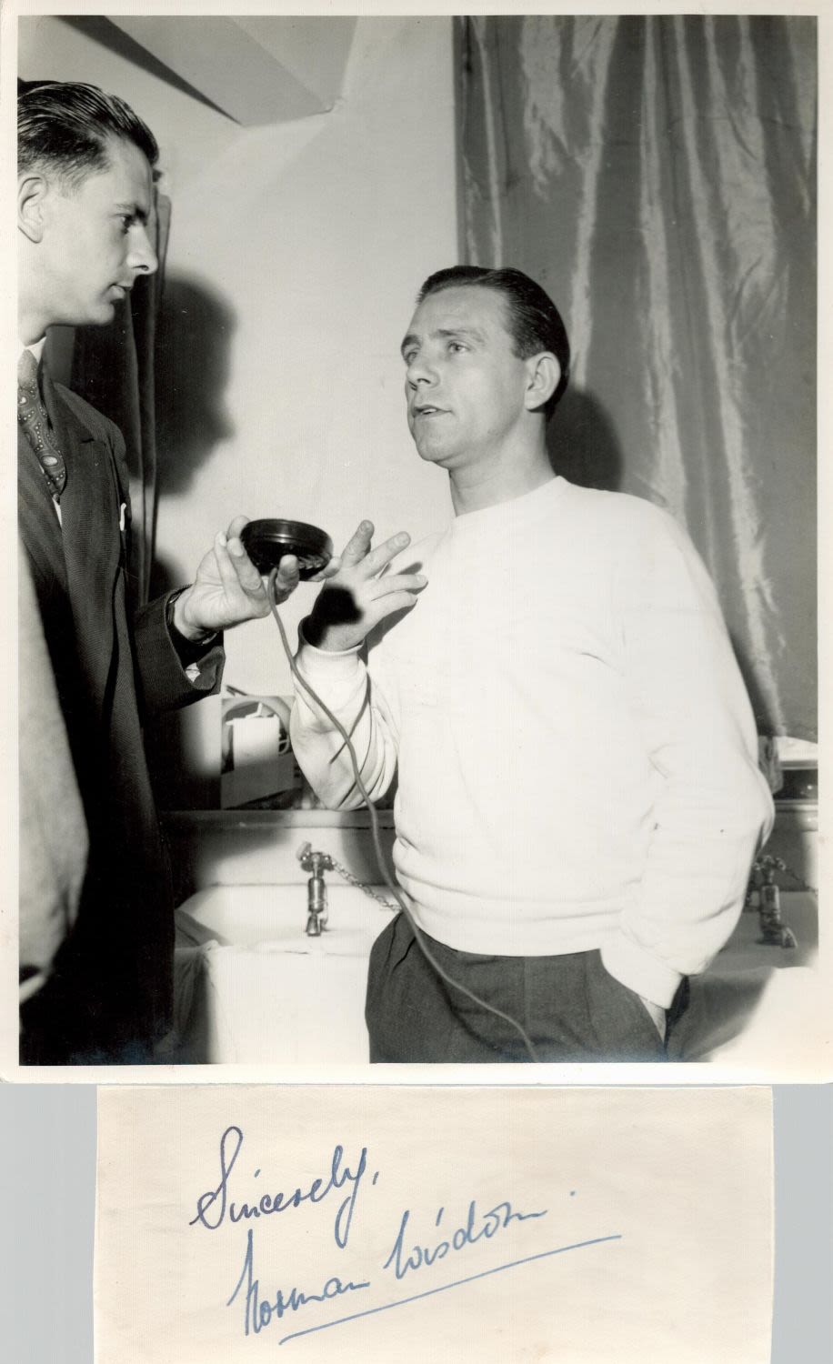 Lot 702: Norman Wisdom signature piece with unsigned press photo....
