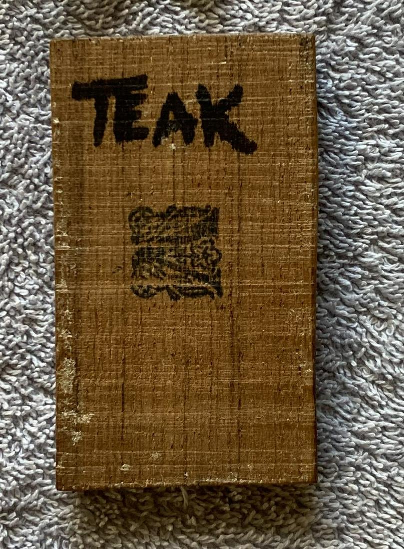 Lot 65: HMS Victory piece of Teak approx. 3 x 2 inches with Copper cladding piece inset on back. All