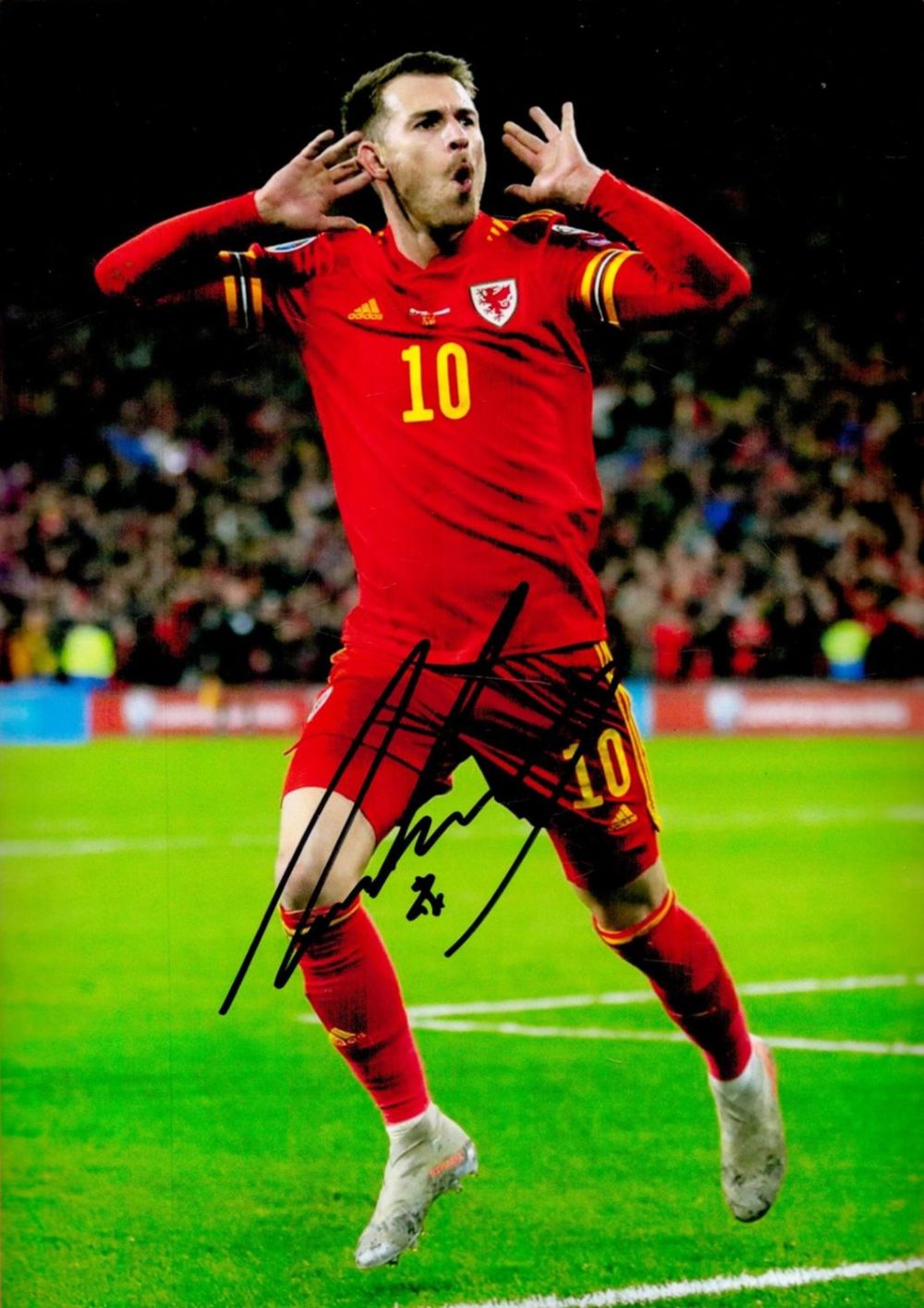 Lot 318: Football Aaron Ramsey signed Wales 12x8 colour photo. Good Condition. All autographs are genuine
