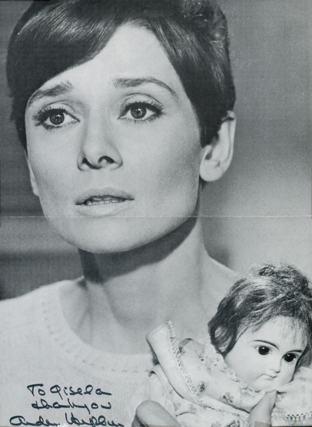 Lot 515: Audrey Hepburn signed 12x8 black and white magazine...