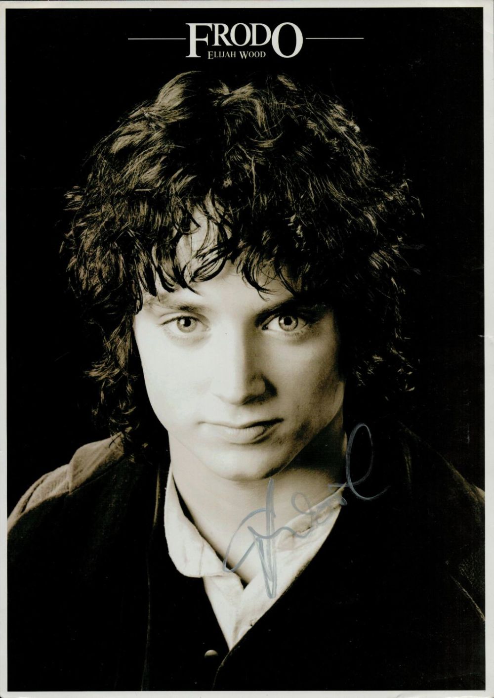 Lot 693: Elijah Wood signed 12x8 inch black and white...