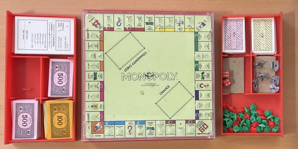 Lot 242: Travel Monopoly, Red plastic case with 2 drawers...