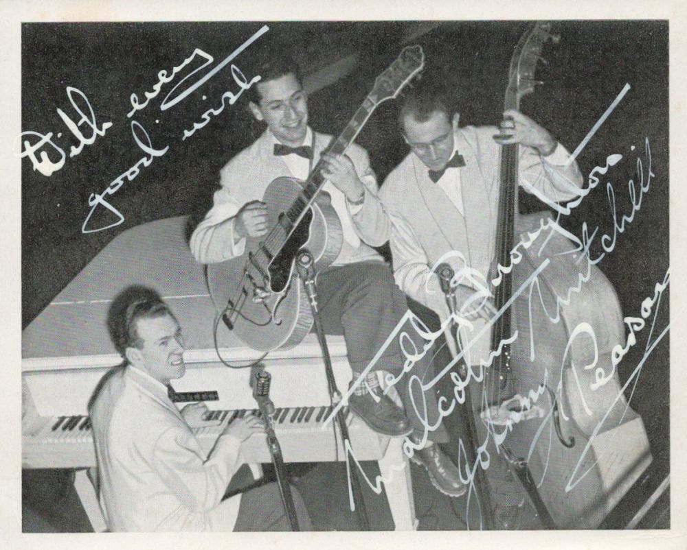 Lot 135: Malcolm Mitchell Trio, a signed (in white ink)...