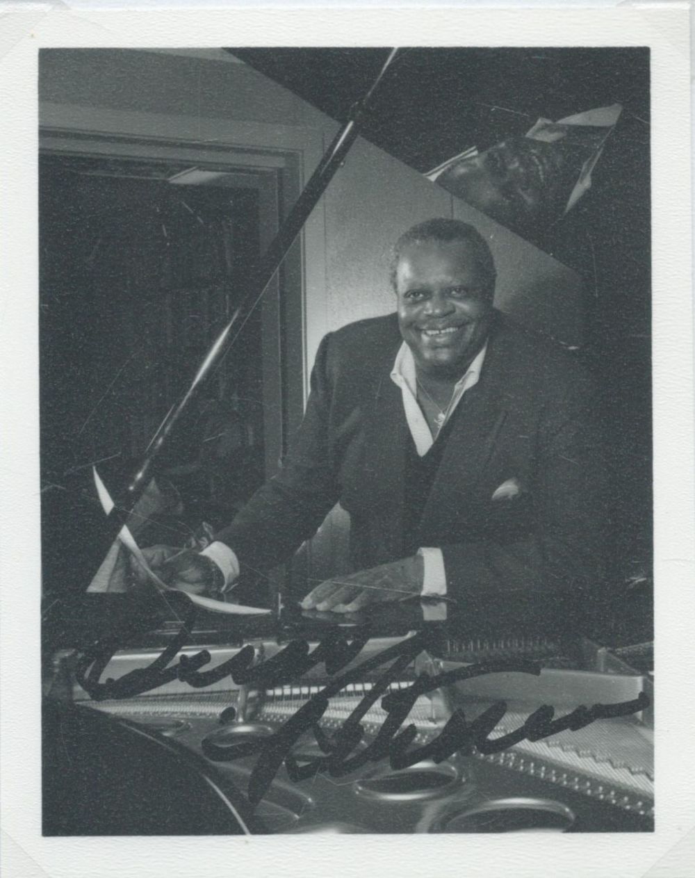 Lot 243: Oscar Peterson signed 5x4inch black and white photo....