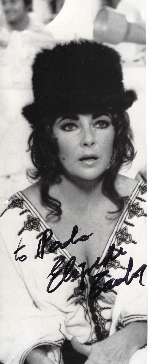 Lot 263: Elizabeth Taylor signed 10x4 black and white photograph...