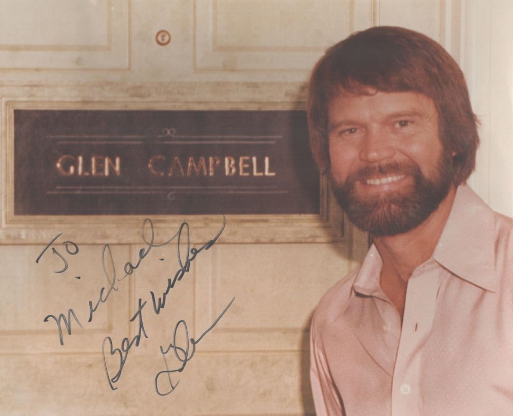 Lot 551: Glen Campbell signed 10x8inch colour photo. Dedicated. Good...