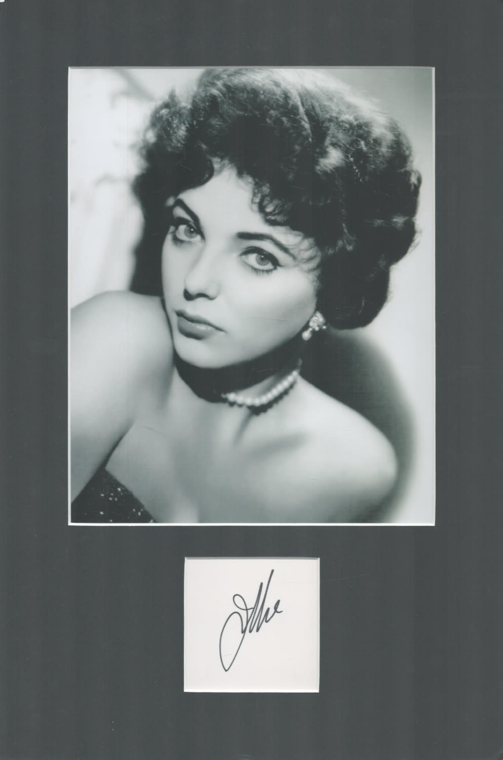 Lot 697: Joan Collins 16x12 inch overall mounted signature piece...