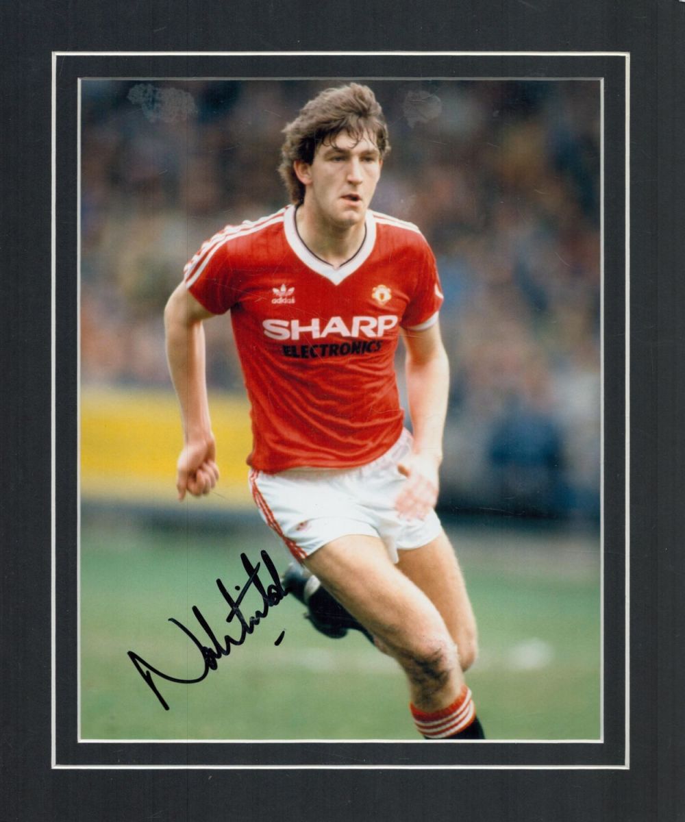 Lot 560: Football Norman Whiteside signed 12x10 mounted colour photo....
