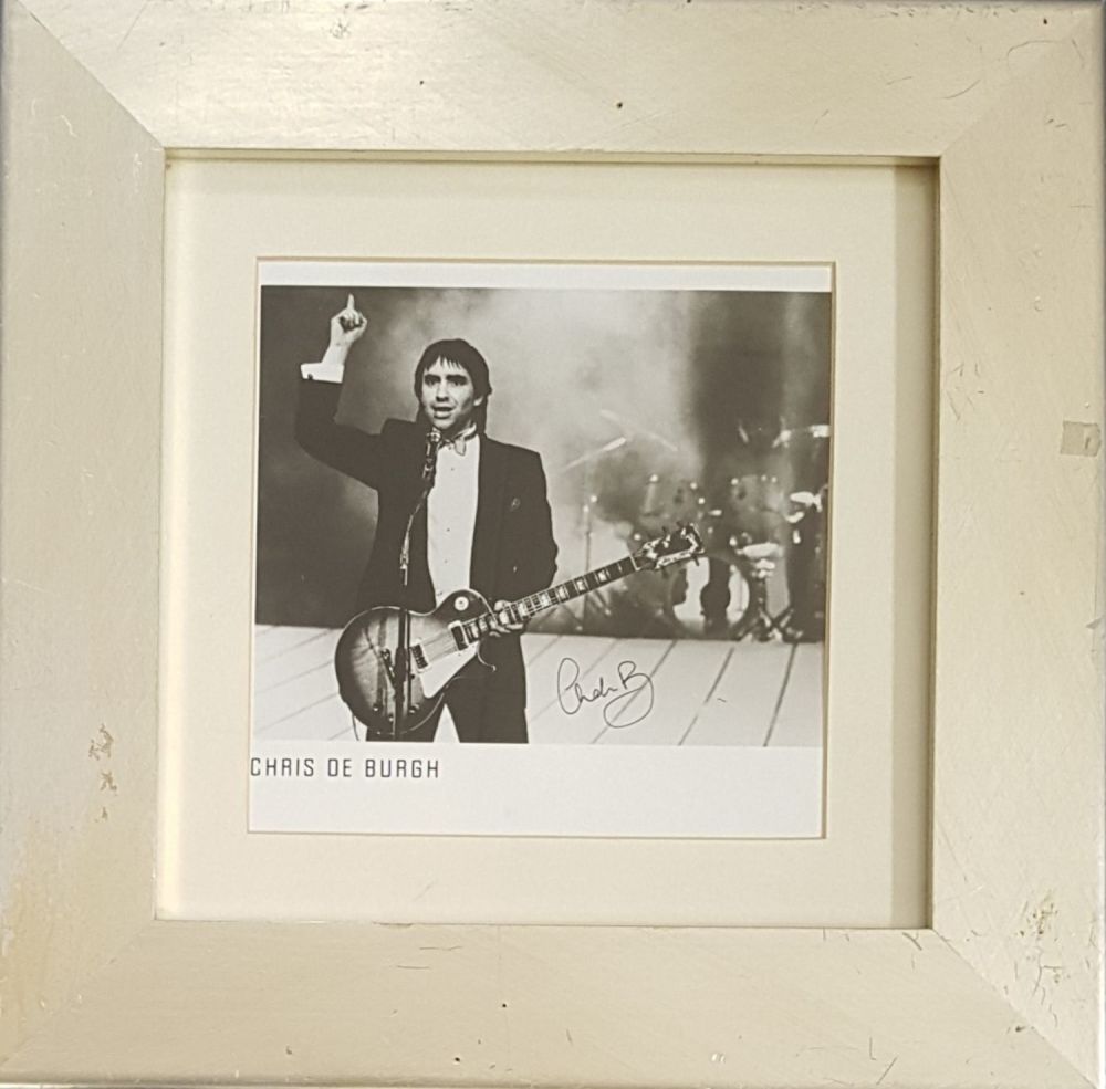 Lot 556: Clive Dunn signature piece mounted below black and...