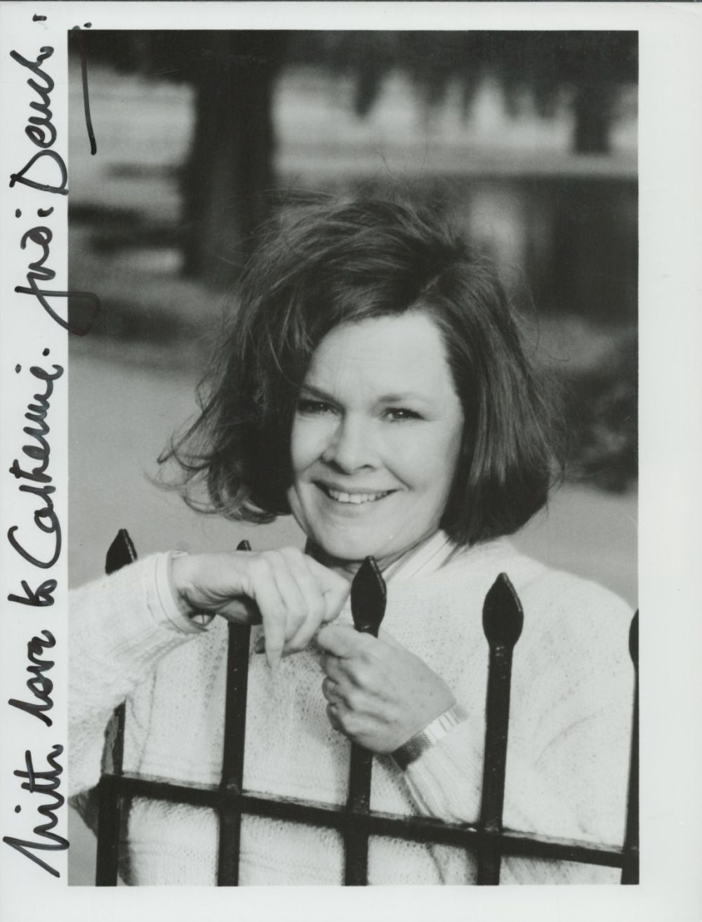 Lot 280: Dame Judi Dench signed black and white photo....