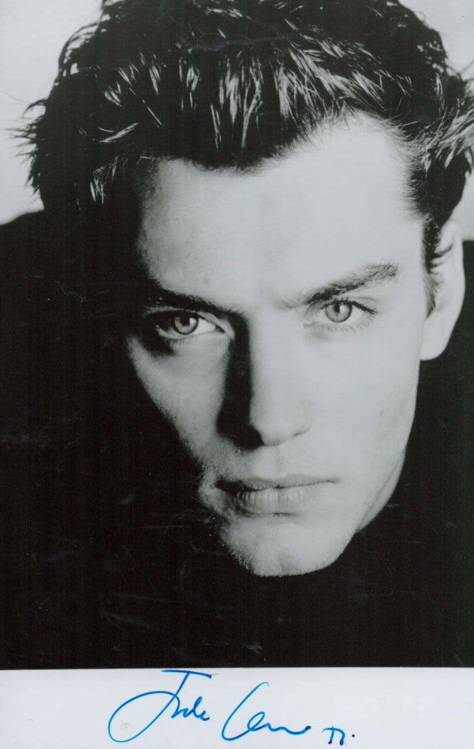 Lot 129: Jude Law signed 6x4inch black and white photo....