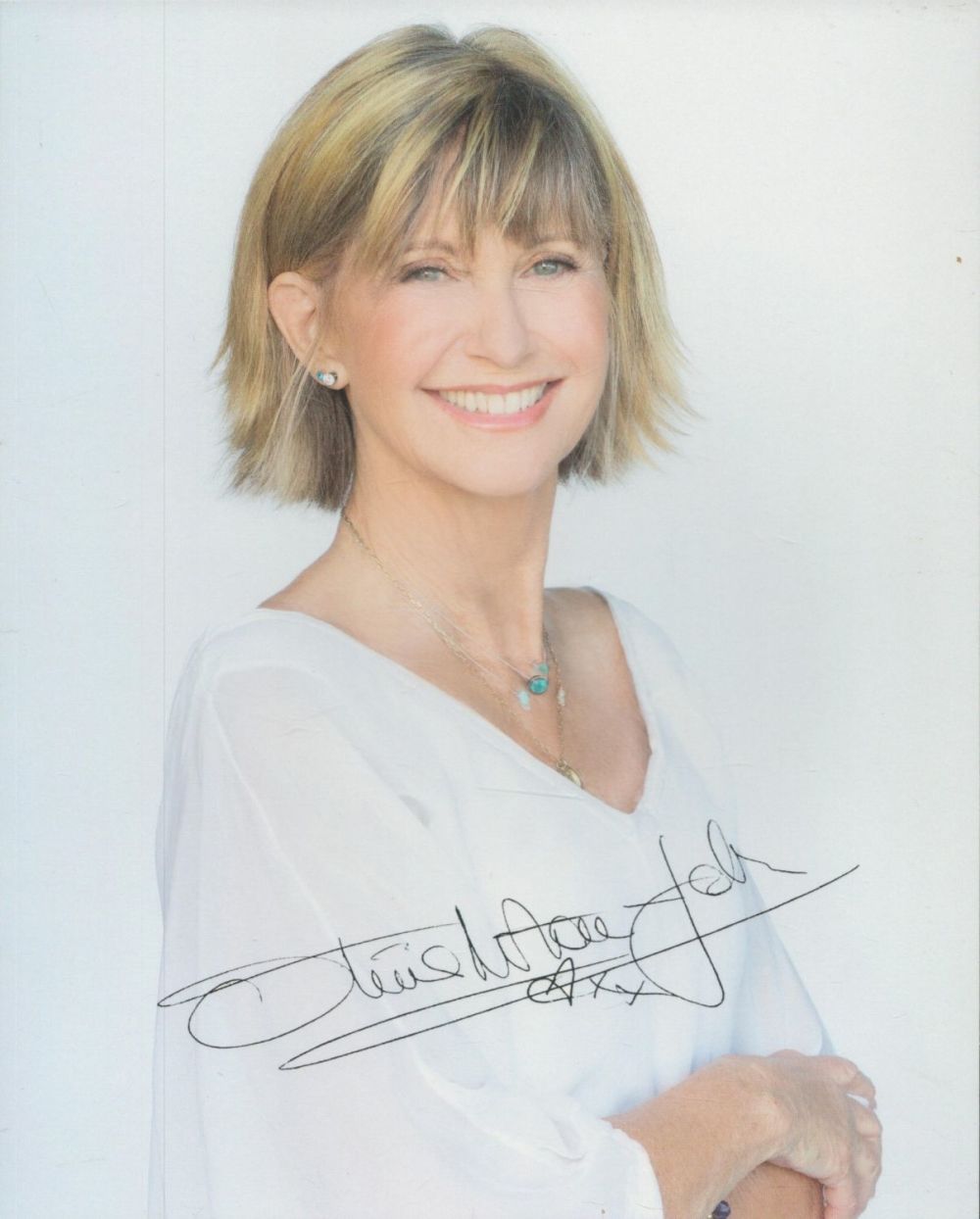 Lot 178: Olivia Newton John signed 10x8 inch colour photo....