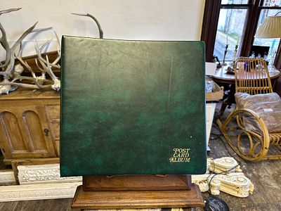 Green photo album. contains personal, military themed and tourist postcards