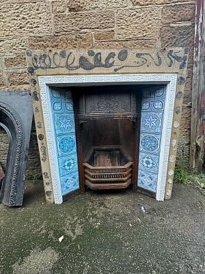 Cast Iron Insert. Please note the Blue &amp; White tiles are stickers over existing tiles that 