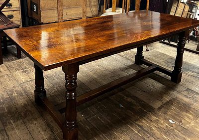 Solid oak refectory table. Constructed from solid oak, often featuring a plank top and gun 