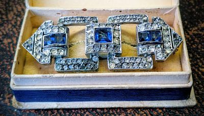 Art Deco Costume Brooch. This vintage Art Deco dress clip or brooch features blue sapphires and 