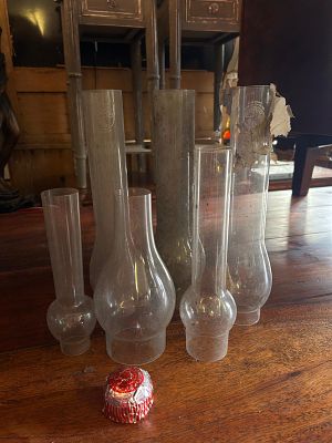 Another lot of antique glass oil lamp chimneys. Also known as lamp globes or hurricanes, which 
