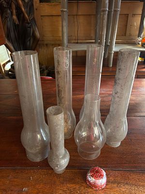 Another lot of antique glass oil lamp chimneys. Also known as lamp globes or hurricanes, which 