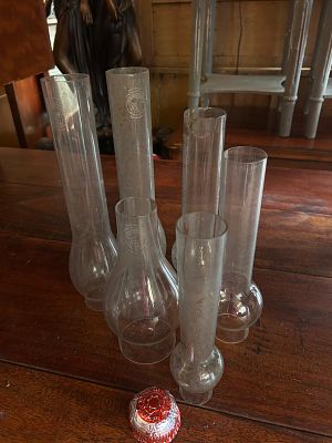 Another lot of antique glass oil lamp chimneys. Also known as lamp globes or hurricanes, which 