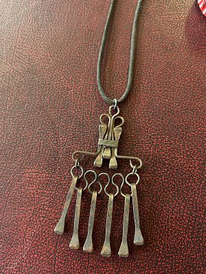 vintage 1970s handcrafted horseshoe nail necklace. Featuring a pendant designed in a Brutalist 