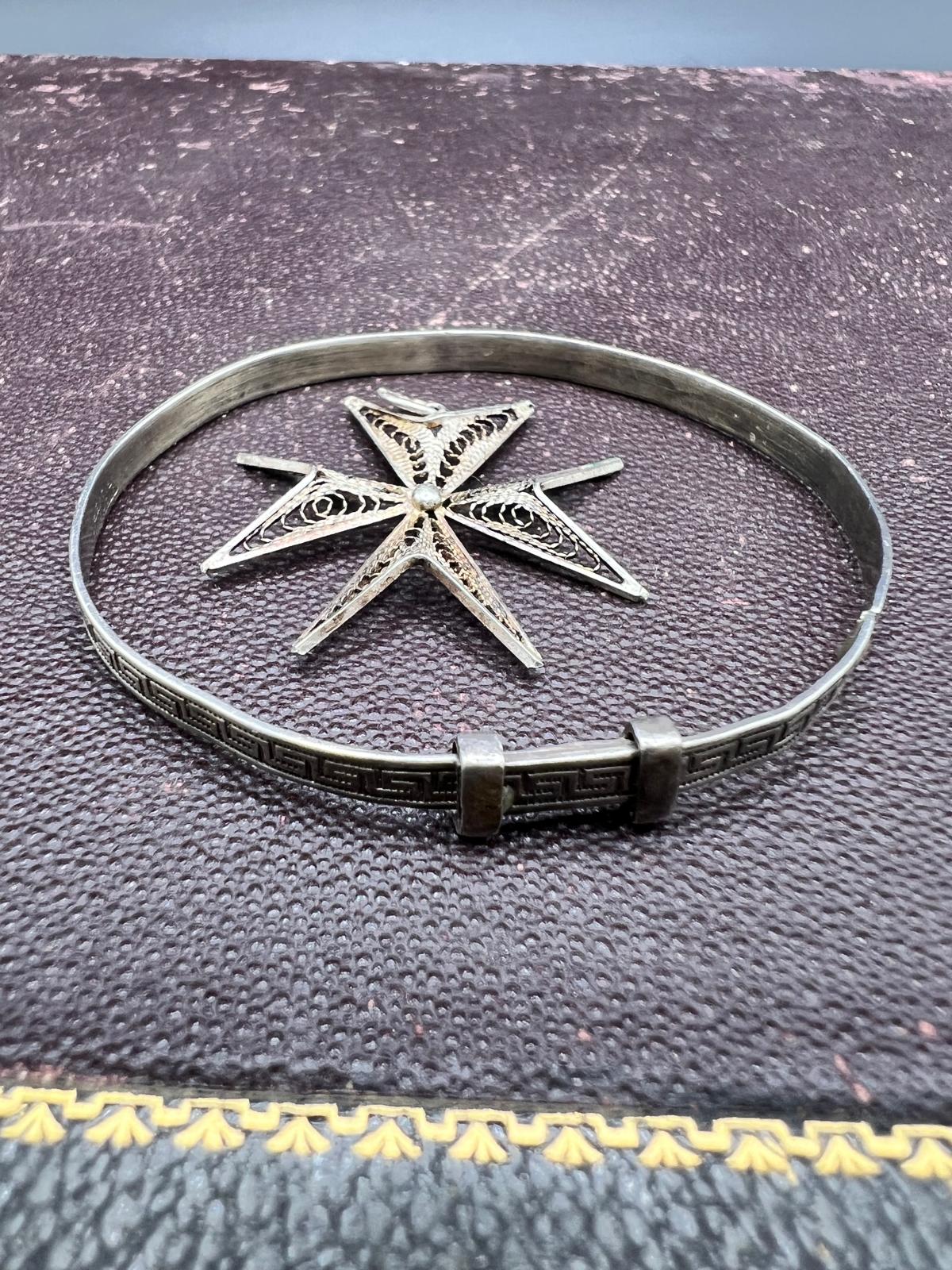 Two Silver Jewelry Items Including a christening Bangle and Filigree Maltese Cross Pendant
