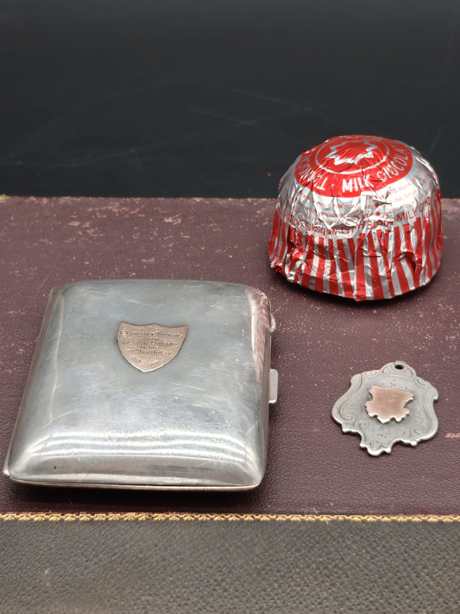 A Deakin and Francis Sterling Silver Cigarette Case with 9 carat Gold Plaque and a Sterling Silver Watch Fob