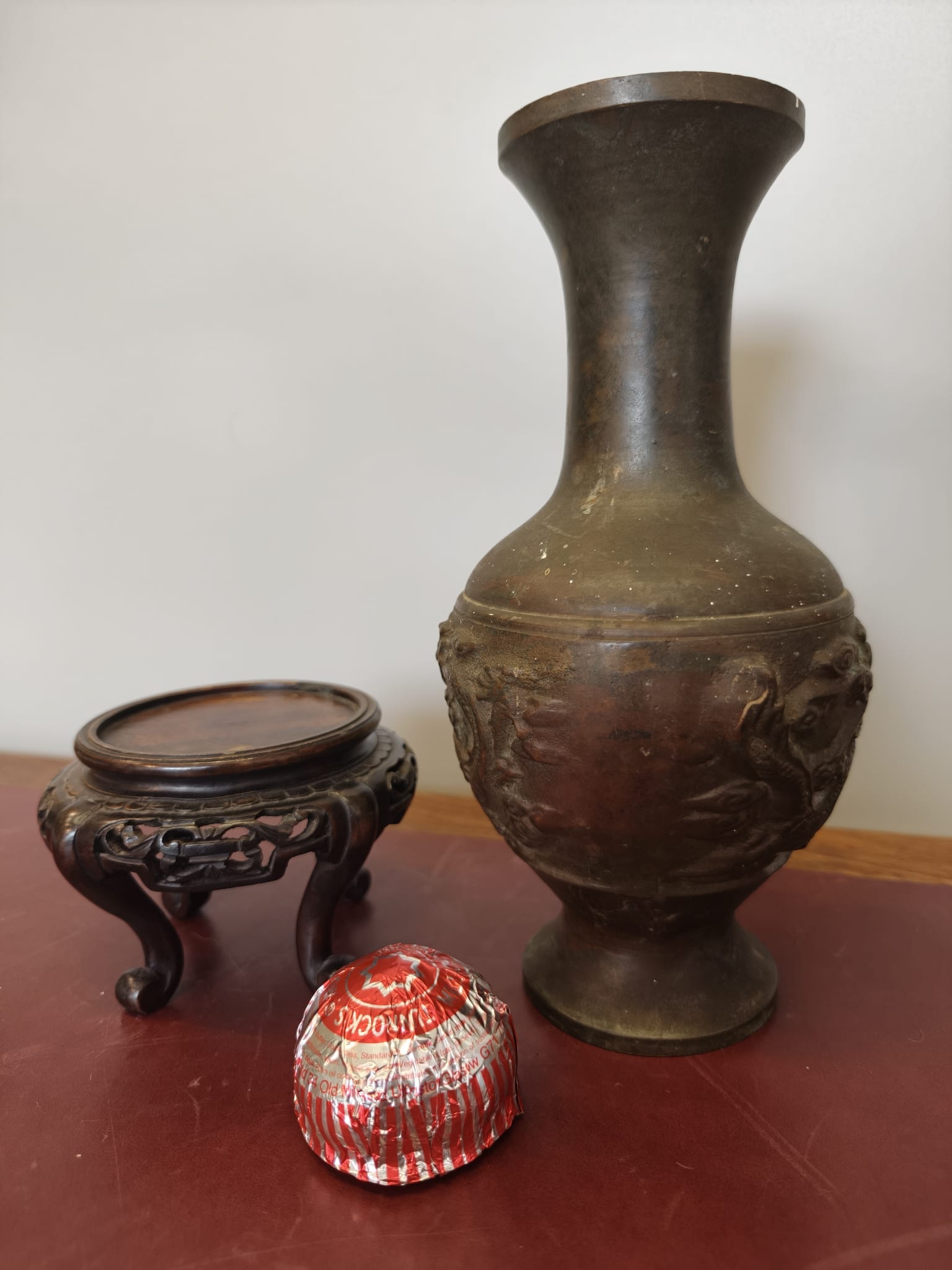 Chinese Relief-Decorated Bronze Dragon Vase and Carved Wood Stand