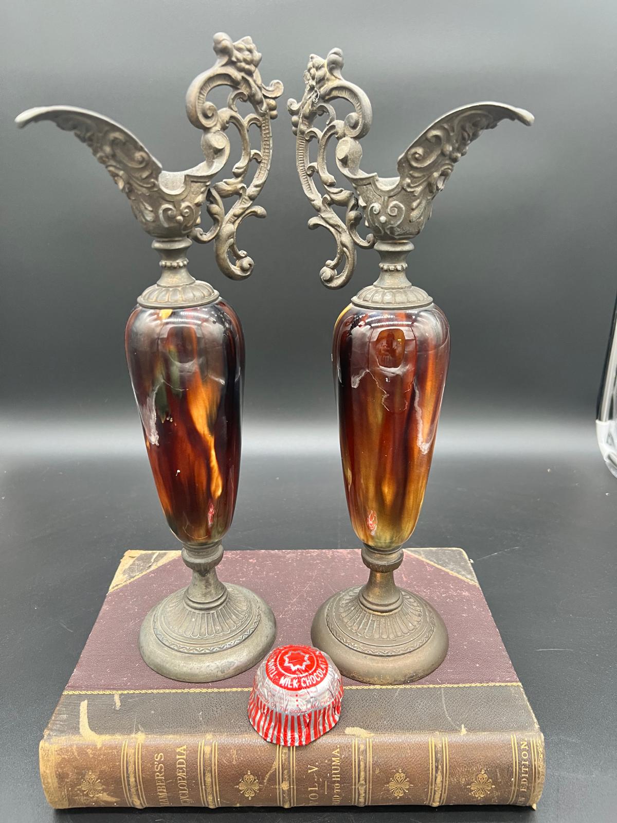 A Pair of Victorian Slag Glass and Patinated Spelter Decorative Ewers