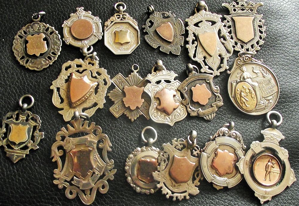 Collection of various silver watch fobs some with gold centres and gold plated centres 1900s 