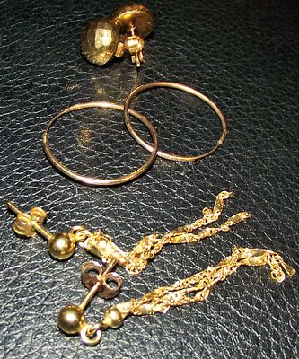 The collection consists of three pairs of 9ct gold earring including studs and hoops and a pair 