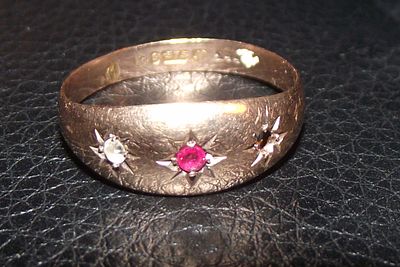 A Edwardian 9k Gold Gypsy Ring Set with Ruby and Diamond one stone missing 1.5g approx . A 