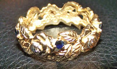 14k gold ring flower design set with diamonds and sapphires 5.4g approx . This eternity band 