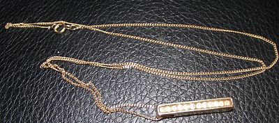A Modern 9ct gold Bar Pendant Necklace set with small diamonds on 9ct gold chain 2.08g approx. Th 