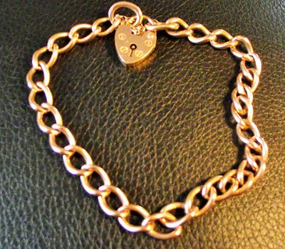 Ladies heavy 9ct rose gold padlock chain bracelet marked 9ct 375 on all links and padlock 