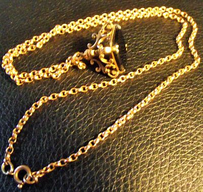 9ct gold belcher chain with 9ct gold mounted black onyx style watch fob 10.05g approx . A 