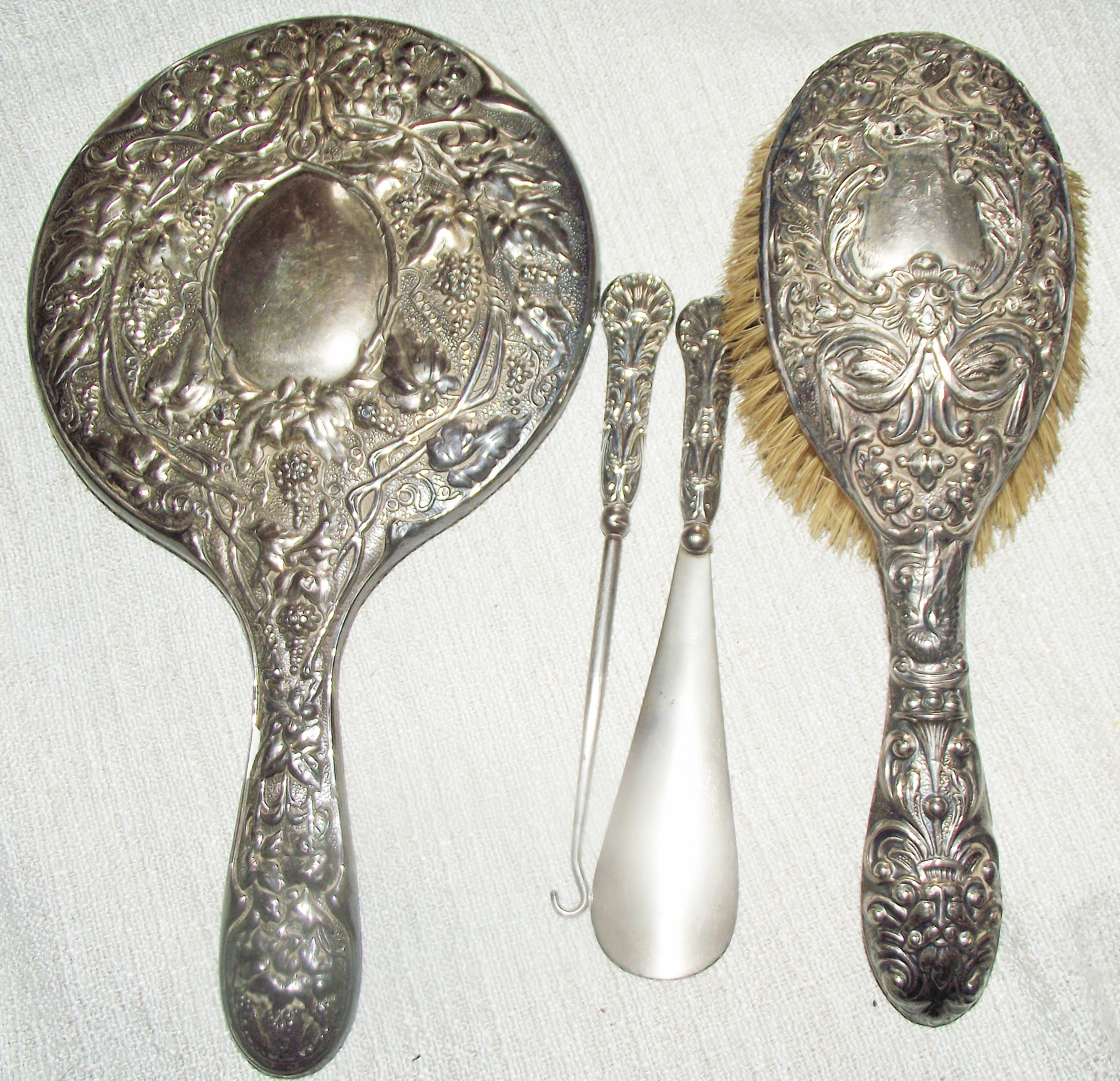 Silver backed clothes brush and mirror + silver topped lace puller & shoe horn various date
