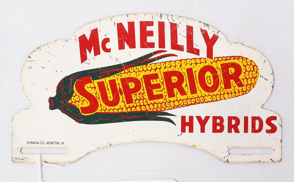 Lot 714: McNeilly Superior Hybrids tin license plate topper by Vernon Co., Newton, IL