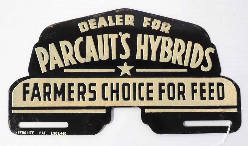 Lot 738: Parcaut's Hybrids Dealer, Farmers Choice For Feed reflective tin license plate topper by Metrolite