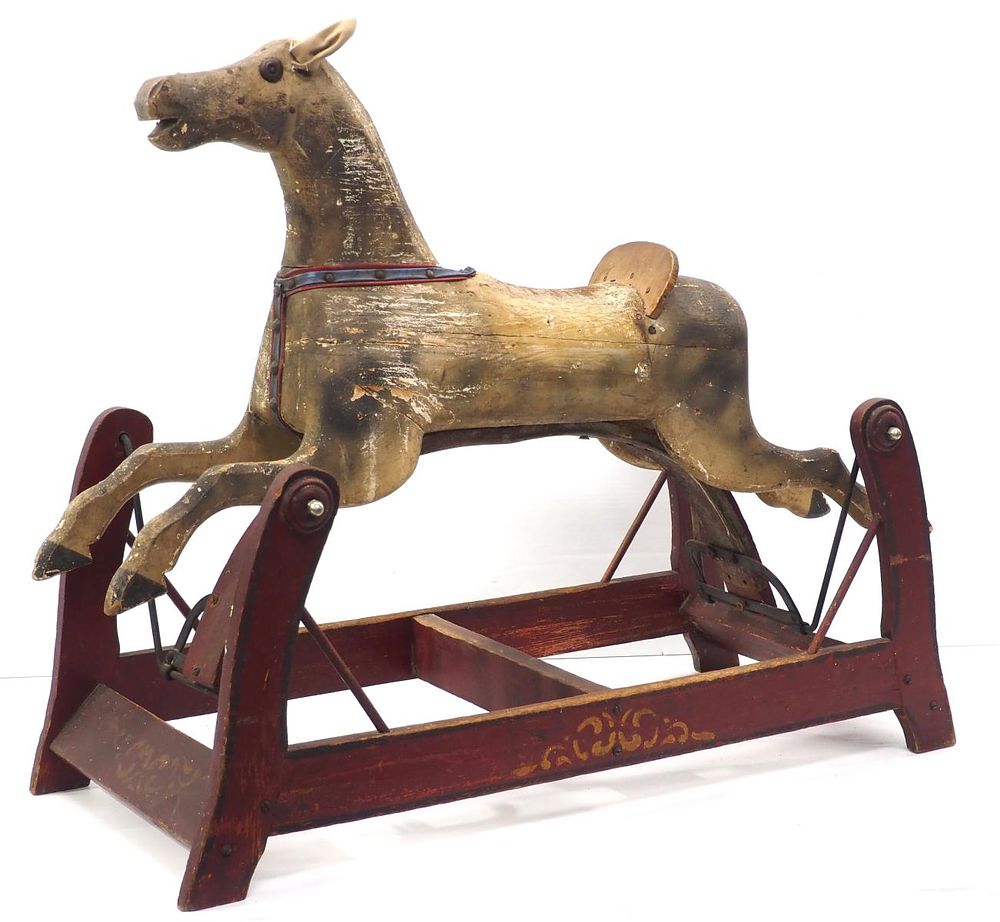 Lot 1206: Early wooden rocking horse with some stenciling on the base, 33"L x 26"H