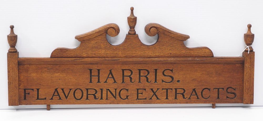Lot 1247: Wooden cabinet advertisement for Harris Falvoring Extracts, 26.5"L x 10.5"H