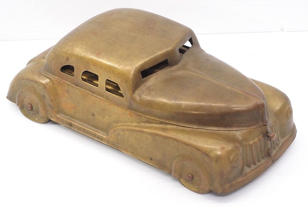 Lot 1308: Betel Motor Car made of brass, patent #75085, 10"L x 5"W x 4"H
