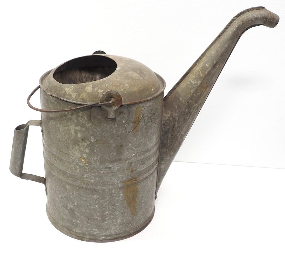 Lot 312: Galvanized tin gas can with handle and spout