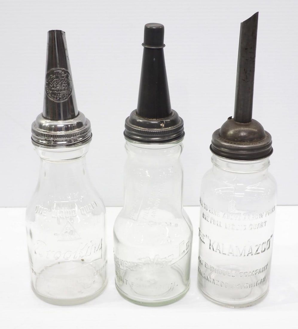 Lot 325: (3) 1-quart glass oil bottles with metal spouts