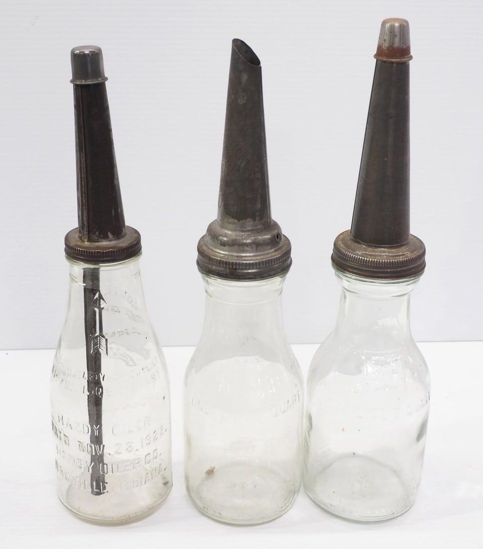 Lot 351: (3) 1-quart glass oil bottles with metal spouts